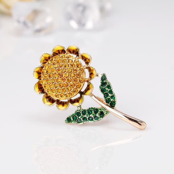 Dam brosch med solros i strass och emalj