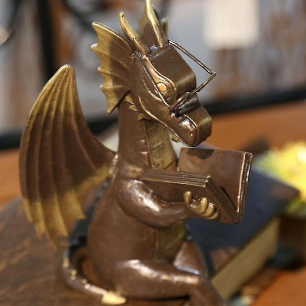 Trädgårdsfigur av dinosaurie i konstgjord harts, klassisk drake som läser