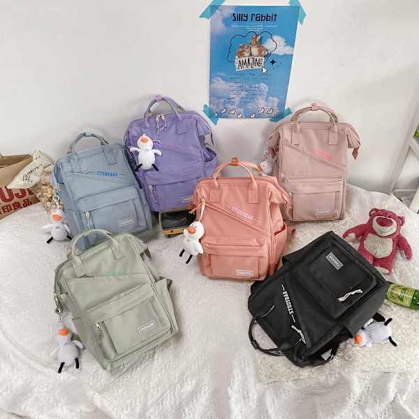 Ryggsäck enfärgad ryggsäck stor kapacitet väska högskolestudent gymnasieelev skolväska resväska Light pink+Duck