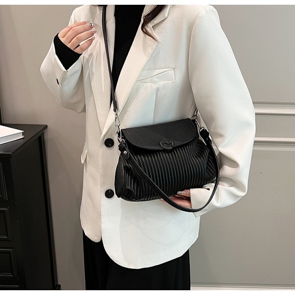 Niche-design, suosittu laskostettu pieni neliölaukku, yksinkertainen ja raikas olkalaukku, joka sopii moneen asuun, crossbody-laukku