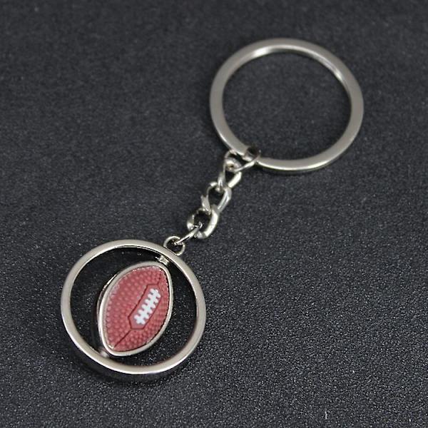 Wabjtam roterande fotbollsnyckelring i metall, legering, nyckelring, charm, nyckelset, rugby, amerikansk fotboll, festtillbehör (silver) (1 st)