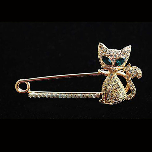 2023 Koreansk legering smycken söta djur grönögd kattunge diamant inlagd sommar ny anti-fri ljus katt brosch gold