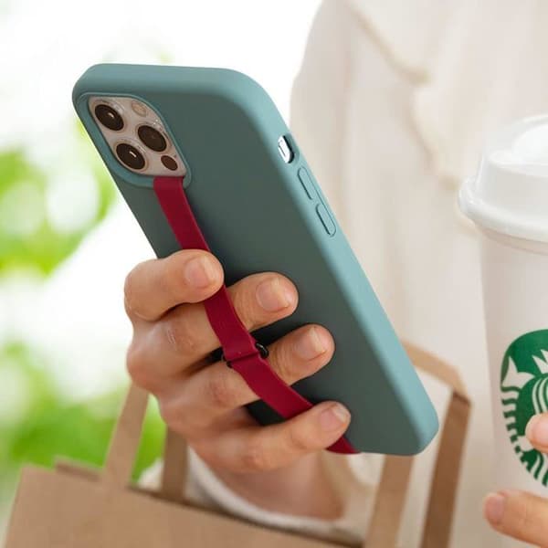 Silikonrem til mobiltelefon med klips, fungerer også som telefonholder.