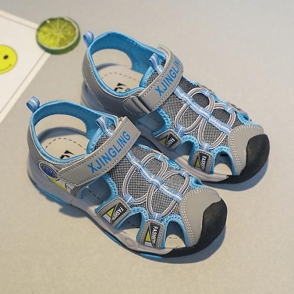 Barnsandaler Mode Halkfria strandskor Pojkar Flickor Antikrocktåhätta Cap Tx308 Blue 34