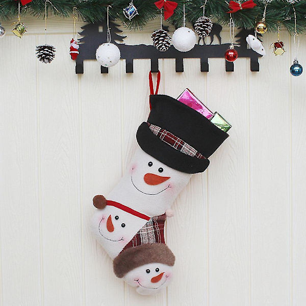 Julklappspåse med julstrumpor, snögubbe, juldekoration