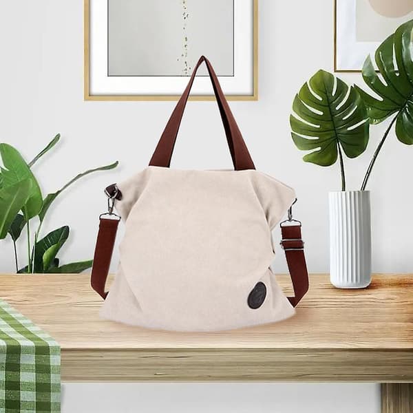 Damer med canvas crossbody-väskor, canvas handväskor, canvas plånböcker och handväskor. Vit