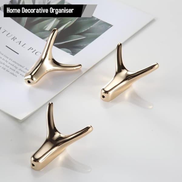 Set med 3 självhäftande väggkrokar i guld, hornformade badrumskrokar