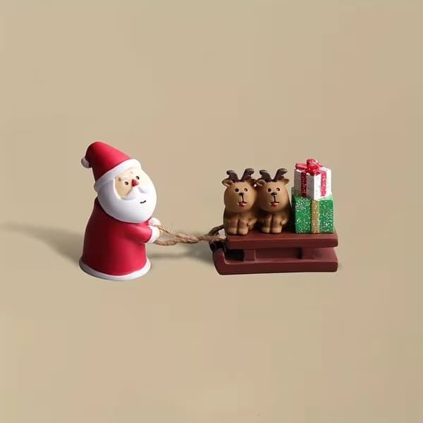 Moderne julemandsslæde miniaturefigur i harpiks til julepynt