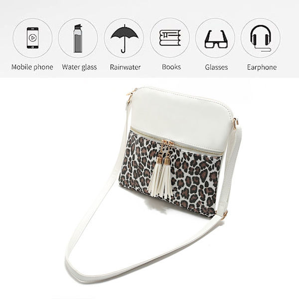 Lätt och medelstor crossbody-väska med tofsprydd ficka och
