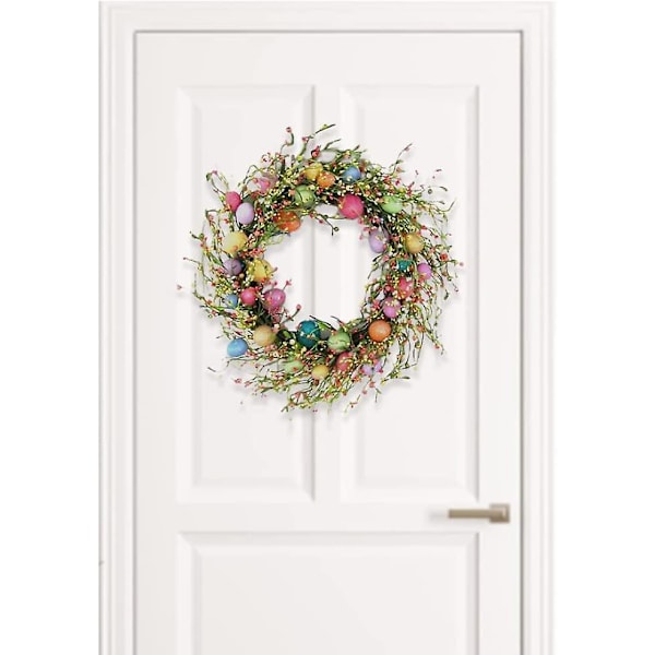 Påskdekorationer, påskkrans, färgade ägg och blandade kvistar vårkrans påskkrans med blommor och bärkärnor vårgirlang konstgjord påsk