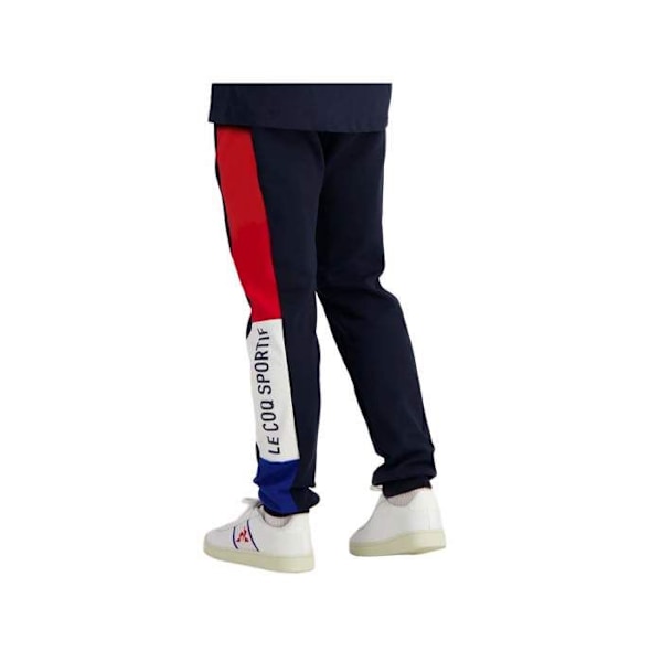 Le coq sportif TRI SLIM träningsbyxor - Ref. 2310016-SKY-KAPTEN. Färg: Marinblå. Detaljer. - Slimmad passform. - Storlek Blå XS