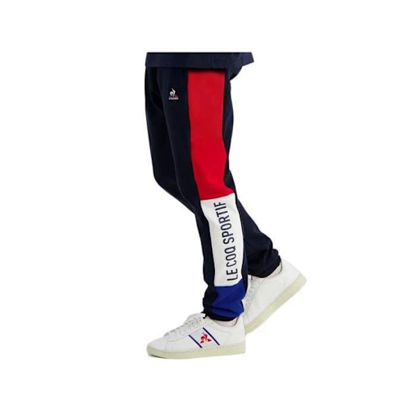 Le coq sportif TRI SLIM träningsbyxor - Ref. 2310016-SKY-KAPTEN. Färg: Marinblå. Detaljer. - Slimmad passform. - Storlek Blå XS