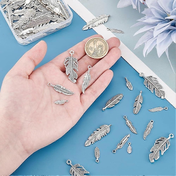 84 st 14 Stilar Fjäderberlocker Hängsmycken Fjäder Smycken Antik Silver Fjäderberlocker Tibetansk Stil Metallberlocker Pärlor för Drömfångare Halsband