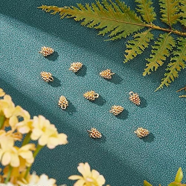 10 kpl Aitoa 18K kullattua messinkiä, riipuskoruja, männynkäpy-koru reiällä DIY-korvakorujen, kaulakorujen ja korujen valmistukseen, 12x8mm