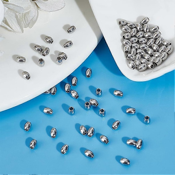 80 kpl ruostumattomasta teräksestä valmistettuja tynnyrihelmiä, ruostumattomasta teräksestä valmistettuja irtokappaleita, 2 mm pienireikäisiä pyöreitä helmiä, metallisia onttoja pallohelmiä, laskuvarjonaruhelmiä korujen valmistukseen