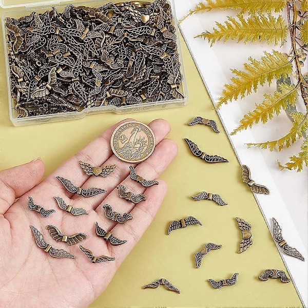 200 st 10 Stilar Änglavingar Berlocker 1-1,5 mm Hål Legering Ving Lösa Distans Berlocker Pärlor Antik Brons Fevingar Pärlor Tibetansk Pärla Distanser för Smycken M
