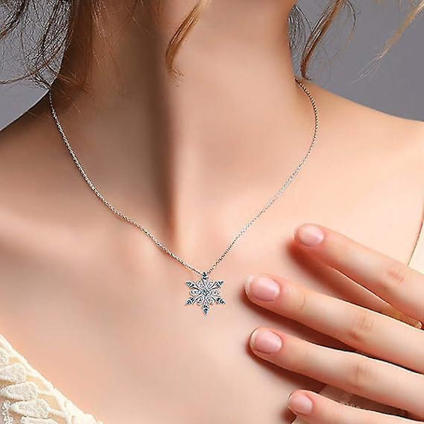Damhalsband i 925 sterling silver med snöflingehänge med blå kristaller och nyckelbenkedja