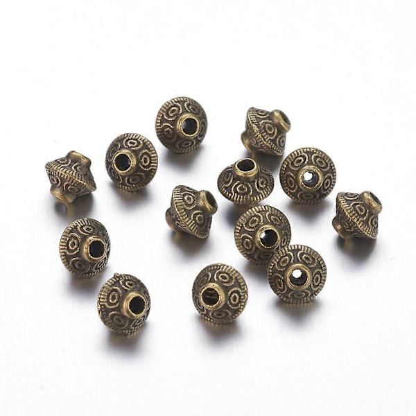 Tiibetiläistyyliset välilevyhelmet, lyijyttömät, kadmiumittomat ja nikkelittömät, bikonikuvioiset, antiikkipronssi, 5,4x6,3 mm, reiän koko: 1 mm