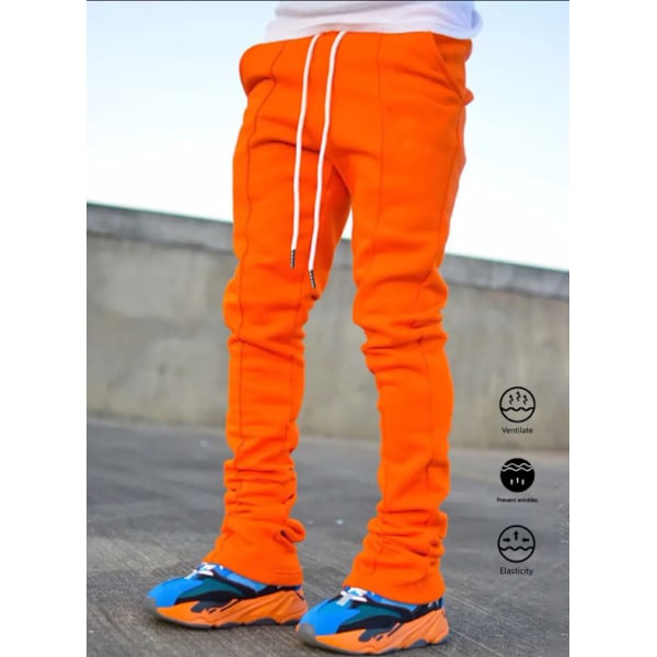 Miesten urheilulliset rennot neljän vuodenajan pitkät levenevät housut slim fit -mallia joustavalla kiristysnyörillisellä vyötäröllä, yksiväriset Orange L