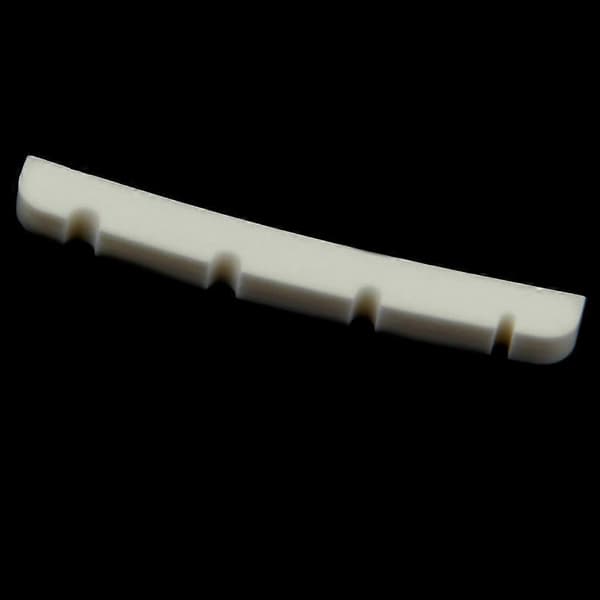42 mm beige räfflad böjd buffelben-sadel för 4-strängade basgitarrer