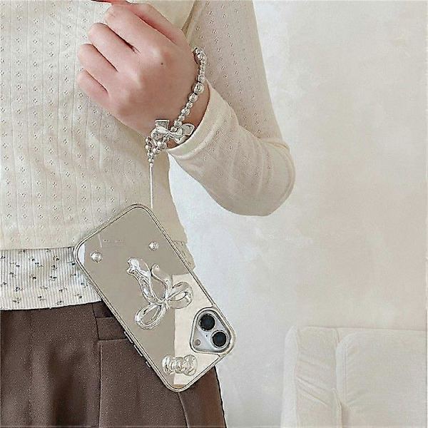 For iPhone 16 Deksel 3D Sløyfe Speiloverflate Design Telefon Bakdeksel med Stropp