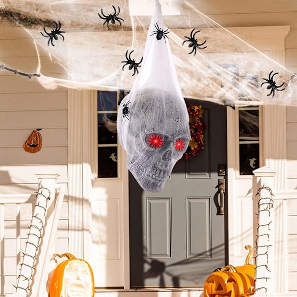 Halloween-kallokoriste Aktivoitu Luurankokallokoriste LED-punaisilla silmillä ja keinotekoisella hämähäkillä Haukutustalon koristeelliset rekvisiitat Halloween-juhlan koristelu Skull
