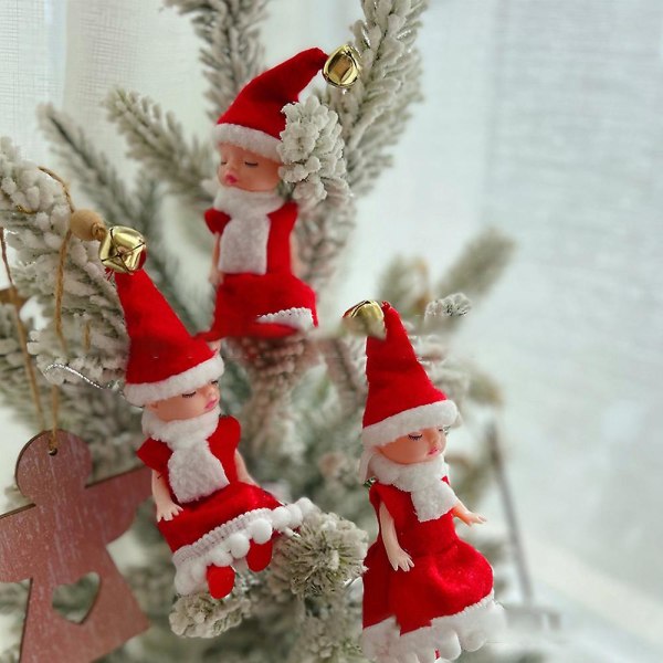 Joulupukin tonttunukke roikkuu koristeena joulupuun kaulakoristelahja