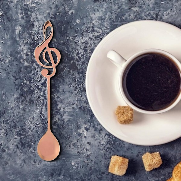 Musiikkinuotti ruostumattomasta teräksestä valmistettu ruusukullanvärinen jälkiruokalusikka kahvin juomiseen ja sekoittamiseen