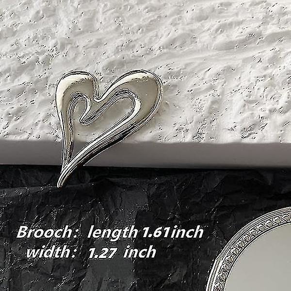 Broscher Hjärtbrosch i guld (guld + silver)