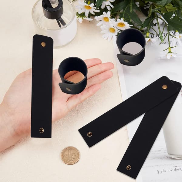Servettringar i läder - Rustika svarta servettringar med spänne