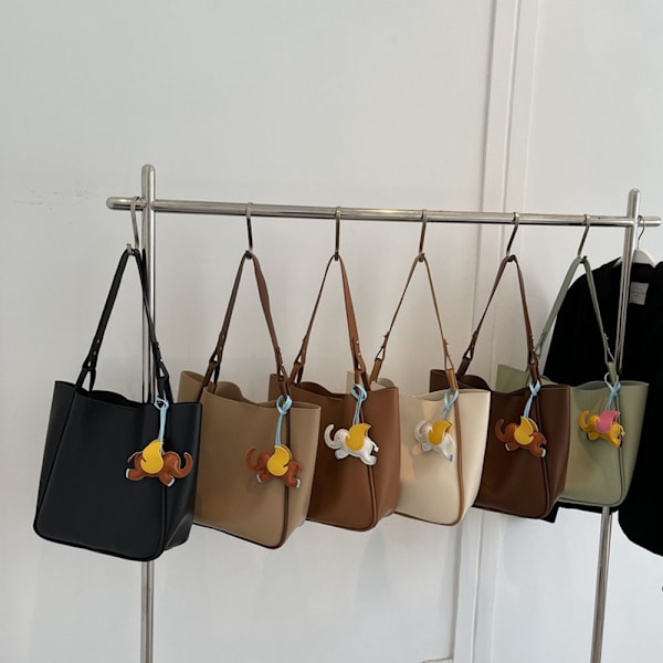 Håndvesker for kvinner - bøttevesker, lommebøker og crossbody-vesker