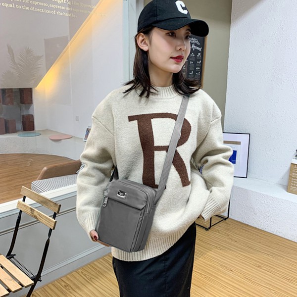 Sports crossbody taske med vandtæt multi-lomme