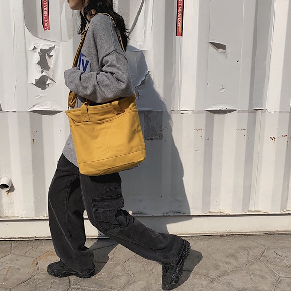 Solidfarget crossbody-veske i canvas for jenter. En skulderveske i canvas, bærbar studentveske