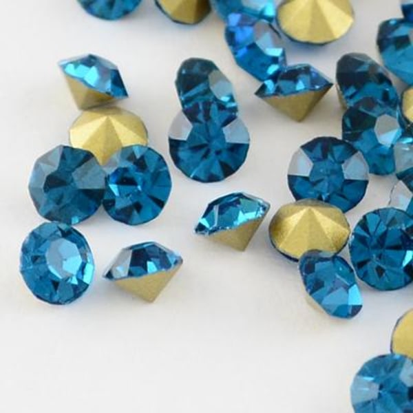 100 Blue Zircon kartiomainen Swarovski upotekoristeelle Ø 3,4 mm (PP27)