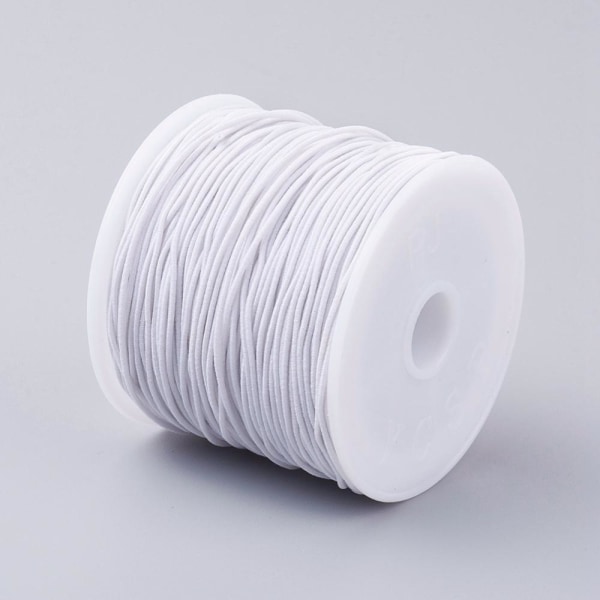 Rulle med  c:a 24-27 mt Vit nylonklädd elastisk tråd 0,8 mm