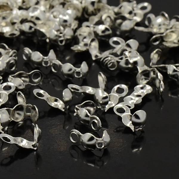100 st Silverpläterade knutgömmor 8x4 mm.