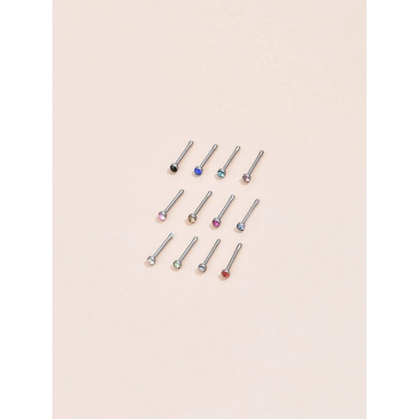 REA__Pack med 12 st. Näspiercing i 316L stål med 2,5 mm CZ