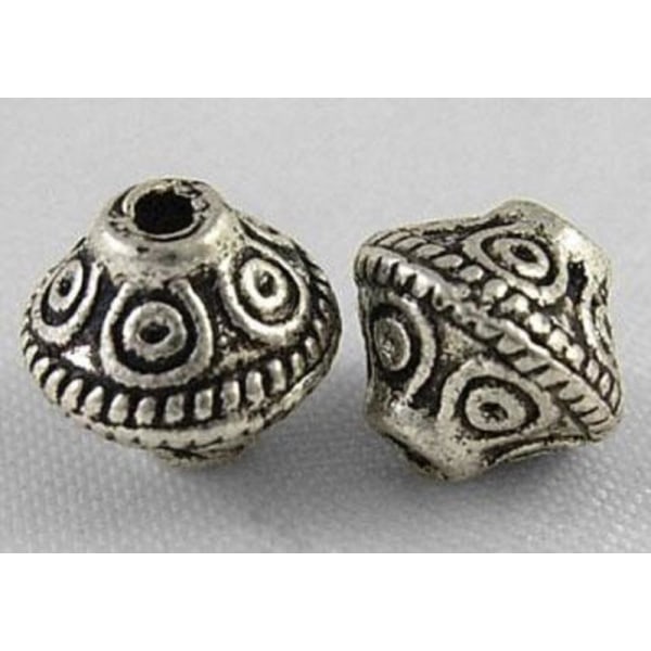 40 st Rondeller i antik tibet silver nickelfria 7x6,5 mm. hål 1