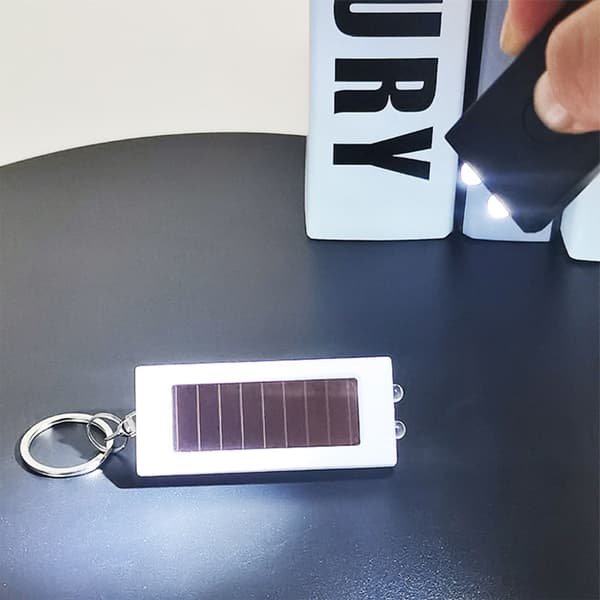 Permanent ABS Nøgleringslys med Solopladning Dobbeltfunktion Krisebelysning til Backpacking null - Black and white