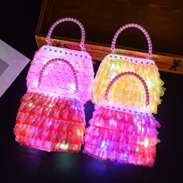 Satunnaisen väriset lapset söpöt pitsiset LED-käsilaukut Tyylikkäät valoisat matkalaukkulelut lapsille tytöille syntymäpäivälahja
