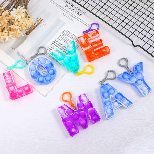 26 Kapital Silikon Fidget Leksak Hänge Pop Leksak