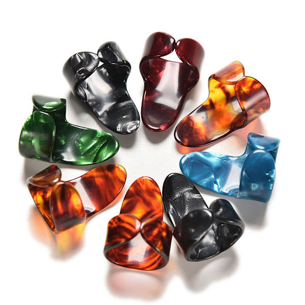 Finger- och tumm-gitarrplockar i celluloid