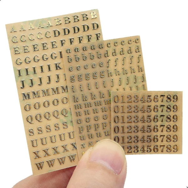 6 ark små 0,12 tums alfabetsnummerklistermärken Glitterlegering självhäftande bokstäverklistermärken Guld