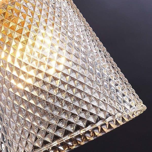 Modern vägglampa i glaskula och mässing