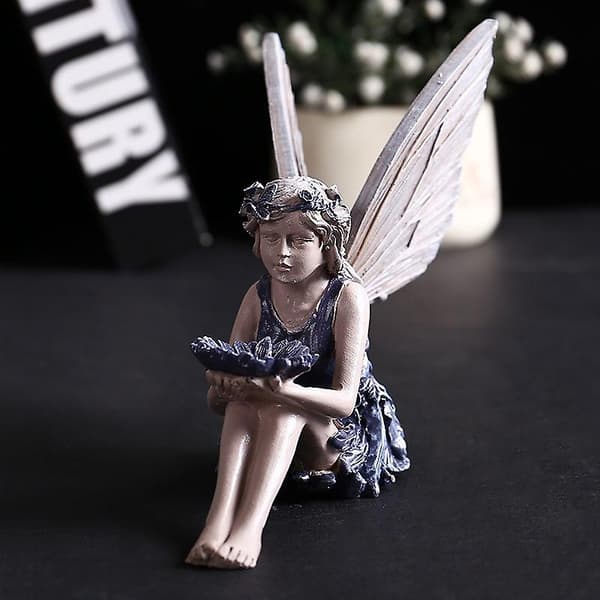 Solsikkefe-statue i harpiks