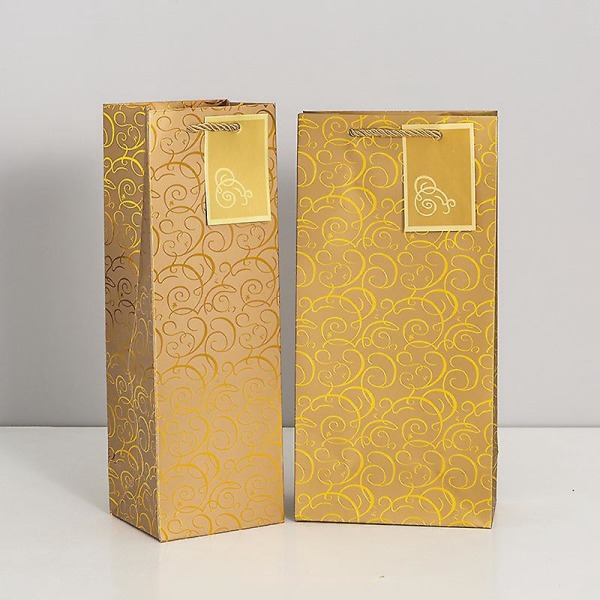 Pakkauksessa 10 kultaa ja hopeaa viini- ja samppanjapullojen lahjapusseja, 12x10x36cm