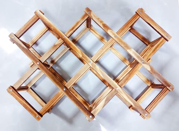 This freestanding, stackable wine rack storage unit is suitable for countertops and cabinets and features a foldable design. One size fits all.