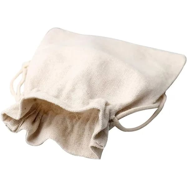 12-pack små bomullspåsar, beige, med dragsko.