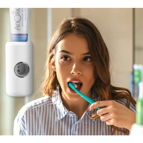 Automaattinen sähköinen hammastahna-annostelija pesuhuoneeseen seinään kiinnitetyllä anturilla (valkoinen)