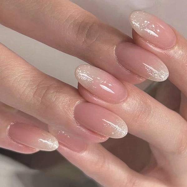 Falska naglar med lim, 24 st Nude Glitter-naglar för kvinnor, Mandelformade rosa press-on-naglar, blanka franska spetsar, medelhög längd